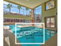 Beautiful community pool with palm trees and large windows for a relaxing atmosphere at 75 E Agate Ave # 206, Las Vegas, NV 89123