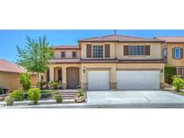 Two-story stucco house with a tile roof, brown shutters, and a two-car garage and landscaped front yard at 7619 Comanche Canyon Ave, Las Vegas, NV 89113
