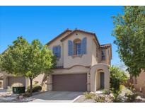 Charming two-story home featuring a two-car garage, arched entryway, and well-maintained landscaping at 7818 Brodie Castle Ct, Las Vegas, NV 89166