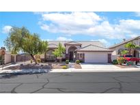 Charming single-story home with a well-maintained front yard and a two-car garage at 786 Craigmark Ct, Henderson, NV 89002