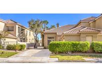 Charming single-Gathering home with well-maintained landscaping and a tile roof at 9220 Pitching Wedge Dr, Las Vegas, NV 89134