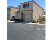 Charming two-story home featuring a one-car garage and low-maintenance landscaping in a desirable neighborhood at 9980 Keephills St, Las Vegas, NV 89183