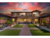 Stunning backyard with manicured lawn, patio, pergola, and balcony, perfect for outdoor living at , Las Vegas, NV 89149