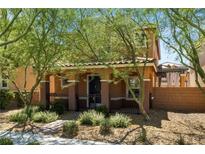Charming two-story home with covered porch and desert landscaping at 2385 Via Firenze, Henderson, NV 89044