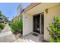 Charming home featuring a secure front door and well-maintained landscaping at 2732 Heritage Ct, Las Vegas, NV 89121