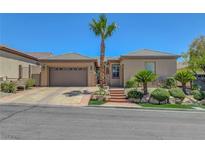 Charming single-story home with well-maintained landscaping, a desert theme, and a two car garage at 2779 Kindeace Ave, Henderson, NV 89044