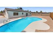 Backyard pool features a sun deck, providing a relaxing and inviting outdoor space at 313 Agora Way, Las Vegas, NV 89110