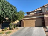 Charming two-story home featuring desert landscaping and a two-car garage at 3813 Juanita May Ave, North Las Vegas, NV 89032