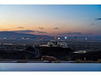 Enjoy stunning Las Vegas city views from this modern home with an infinity pool overlooking the vibrant skyline at 720 Dragon Peak Dr, Henderson, NV 89012