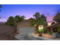 Charming single-story home with a two-car garage and desert landscaping at 8563 Red Diamond St, Las Vegas, NV 89123