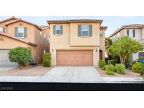 Inviting two-story home featuring a well-maintained front yard and attached two-car garage at 8930 W Ford Ave, Las Vegas, NV 89148