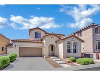 Charming two-story home with well-maintained landscaping and a two-car garage at 9131 Grand Sunburst Ct, Las Vegas, NV 89149