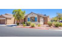 Inviting single-story home with desert landscaping and charming blue shutters at 9321 Lady Finger Ct, Las Vegas, NV 89149