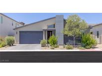 Modern single-story home with desert landscaping and a gray accent chimney at 9785 Granite Mesa St, Las Vegas, NV 89141