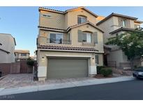 Inviting two-story home with a two-car garage and charming architectural details at 10725 Wrigley Field Ave, Las Vegas, NV 89166