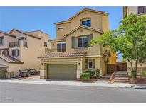 Charming three-story home with a two-car garage and well-maintained landscaping at 10725 Wrigley Field Ave, Las Vegas, NV 89166