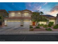 Stunning two-story home featuring a three-car garage and a meticulously landscaped front yard at 2010 Catalina Marie Ave, Henderson, NV 89074