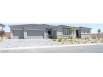 Attractive single-story home with a three-car garage and stone accents in a well-maintained landscape at 4630 Blushing Dawn Ave, Las Vegas, NV 89118