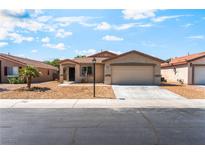 Charming single-story home with low maintenance landscaping and a two-car garage at 4837 River Splash Ave, Las Vegas, NV 89131