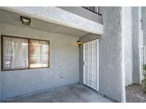 Exterior of home features a window and storm door entrance at 5219 Caliente St # 11, Las Vegas, NV 89119