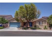 Charming single-story home with a well-manicured front yard and a delightful desert landscape at 5896 Shining Moon Ct, Las Vegas, NV 89131