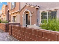Charming townhome featuring a private entrance and well-maintained landscaping at 10013 Sable Point St, Las Vegas, NV 89178