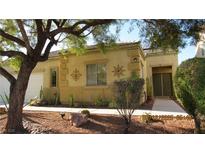 Charming single story home featuring xeriscaping, desert landscaping, and a two-car garage at 1504 Andrew David Ave, North Las Vegas, NV 89086