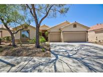 Charming single-story home featuring a two-car garage and xeriscaped front yard at 2475 Sedona Cedar Ave, Henderson, NV 89052