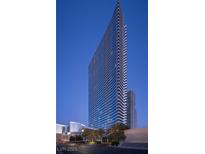 Striking architectural design of luxury high-rise with a backdrop of a clear blue sky at 4471 Dean Martin Dr # 2406, Las Vegas, NV 89103