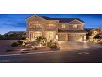 Beautiful two-story home with a well-manicured front yard and a spacious two-car garage at 6958 Lazy Sunset Ct, Las Vegas, NV 89156