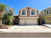 Charming two-story home with a spacious two-car garage and well-maintained front yard at 8125 Rio De Janeiro Dr, Las Vegas, NV 89128