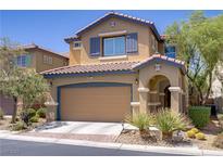 Charming two-story home featuring a two-car garage and a beautifully landscaped front yard at 8656 Rowland Bluff Ave, Las Vegas, NV 89178