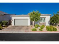 Charming single story home featuring a two car garage, desert landscaping, and bright stucco at , Las Vegas, NV 89166