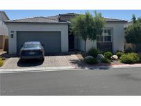 Charming single-story home features a two-car garage and a beautifully landscaped front yard at , Las Vegas, NV 89166