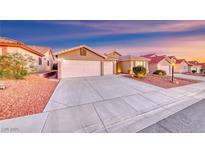Charming single-story home with a well-manicured yard and a spacious three-car garage at 1643 Silver Slipper Ave, Henderson, NV 89002