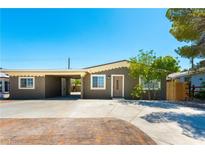 Charming single-story home features a covered parking area and a well-maintained front yard at 1916 Howard Ave, Las Vegas, NV 89104