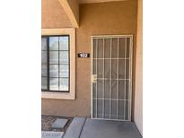 Apartment 102 with a screen door and a window to the left at 2019 Rancho Lake Dr # 102, Las Vegas, NV 89108