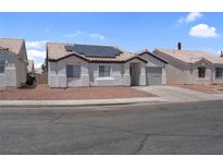 Charming single-story home featuring desert landscaping and solar panels for energy efficiency at 2832 Sing Song Way, Las Vegas, NV 89106