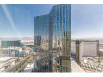 Striking high-rise building with expansive glass windows showcasing a modern architectural design and vibrant city views at 3722 Las Vegas Blvd # 3209, Las Vegas, NV 89158
