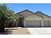 Charming single-story home with desert landscaping and a spacious three-car garage at 4620 Ventana Rey St, North Las Vegas, NV 89081