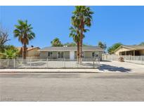 Charming single-story home with desert landscaping and mature palm trees at 4825 Stillwater Ave, Las Vegas, NV 89110