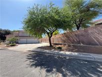 Charming home with a three-car garage and mature landscaping in a quiet residential neighborhood at 6293 Pavestone Ln, Las Vegas, NV 89142