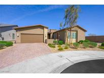 Charming single-story home with desert landscaping and a brick-paved driveway at 6602 Windy Palm St, North Las Vegas, NV 89086