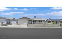 Charming single-story home featuring a two car garage, well-maintained landscaping, and solar panels at 808 Vermillion Dr, Henderson, NV 89002
