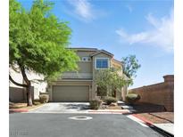 Charming two-story home with a well-maintained front yard and attached two car garage at 9004 Harbor Wind Ave, Las Vegas, NV 89178