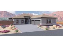 Charming single story home featuring a neutral color scheme, a two car garage, and desert landscaping at 1860 Old West Ave, Pahrump, NV 89048