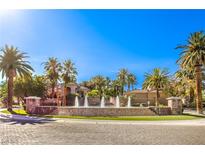 Beautiful community fountain surrounded by lush palm trees and well-manicured landscaping on a sunny day at 2050 W Warm Springs Rd # 1923, Henderson, NV 89014