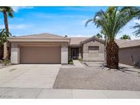 Charming single-story home with desert landscaping, a two-car garage, and a well-maintained yard at 2118 High Mesa Dr, Henderson, NV 89012