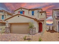 Inviting two-story home featuring a red door, neutral siding, and a well-manicured front yard at 2728 Tricase St, Henderson, NV 89044