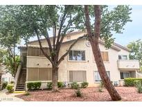 Charming multi-level condo with a classic stucco exterior and mature landscaping at 3101 Casey Dr # 204, Las Vegas, NV 89120